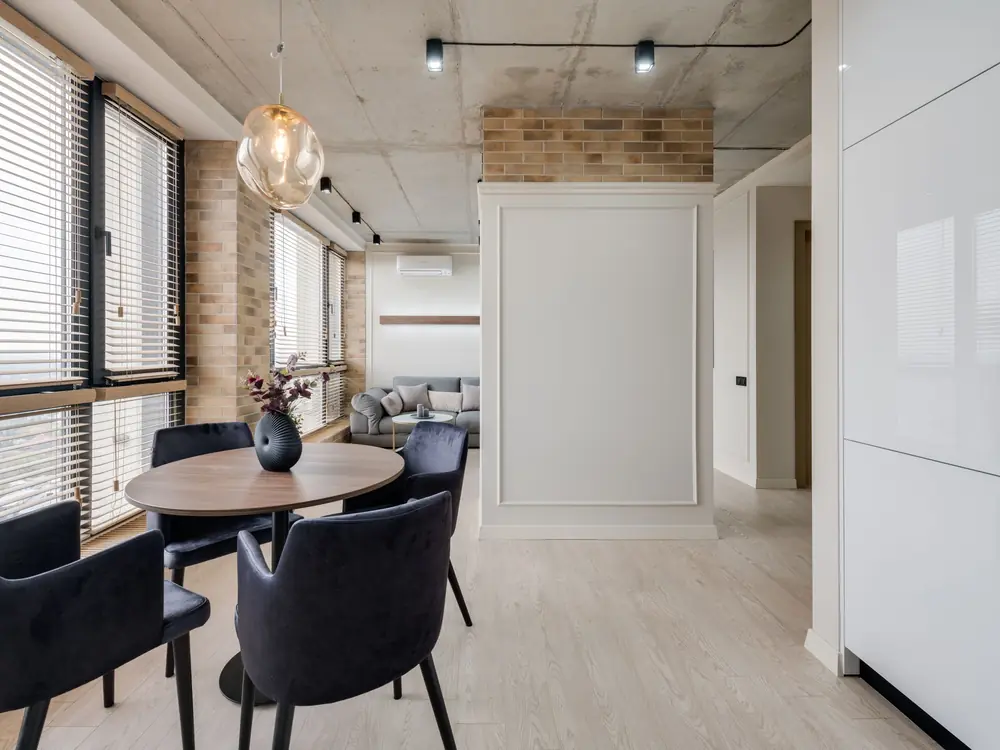 Corporate office breakout area in Ebene with slim blinds across a run of windows