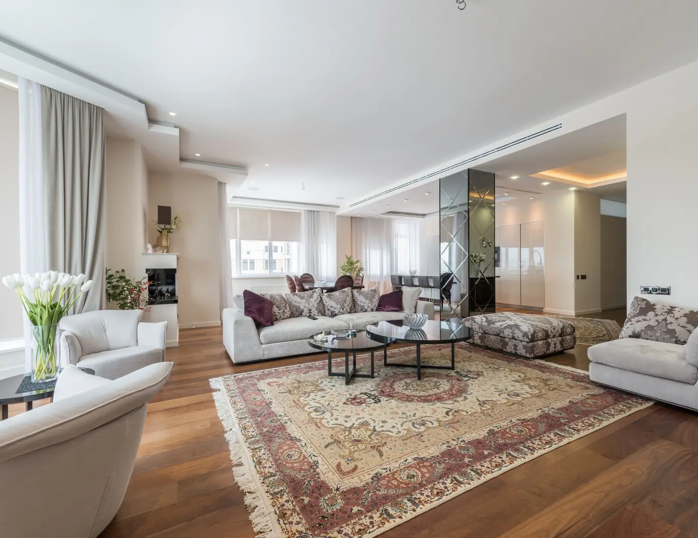Private residence living room in Moka with full-length curtains and pale timber floors