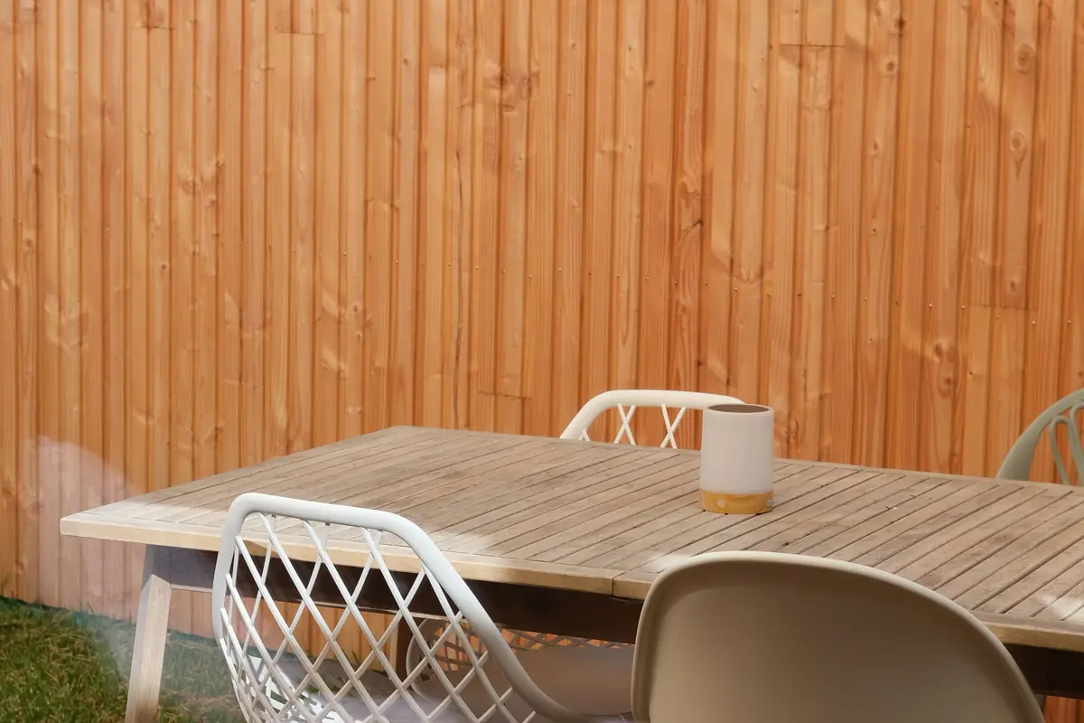 Timber slat privacy screen sheltering an outdoor terrace